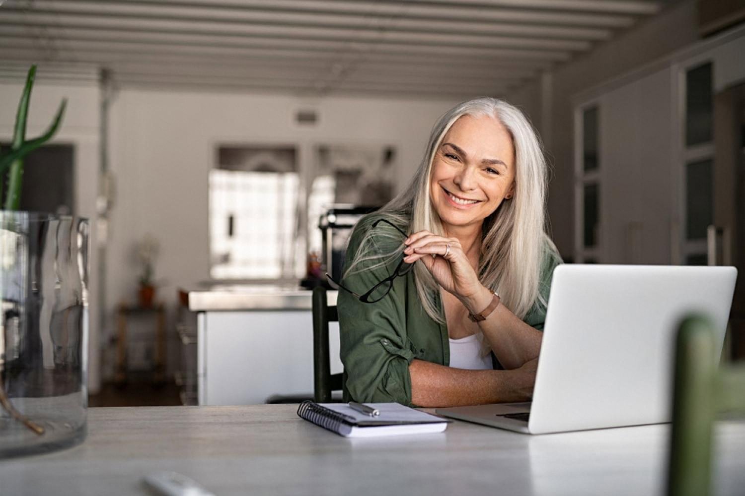 Small business owner in the UAE working on a laptop to launch her website